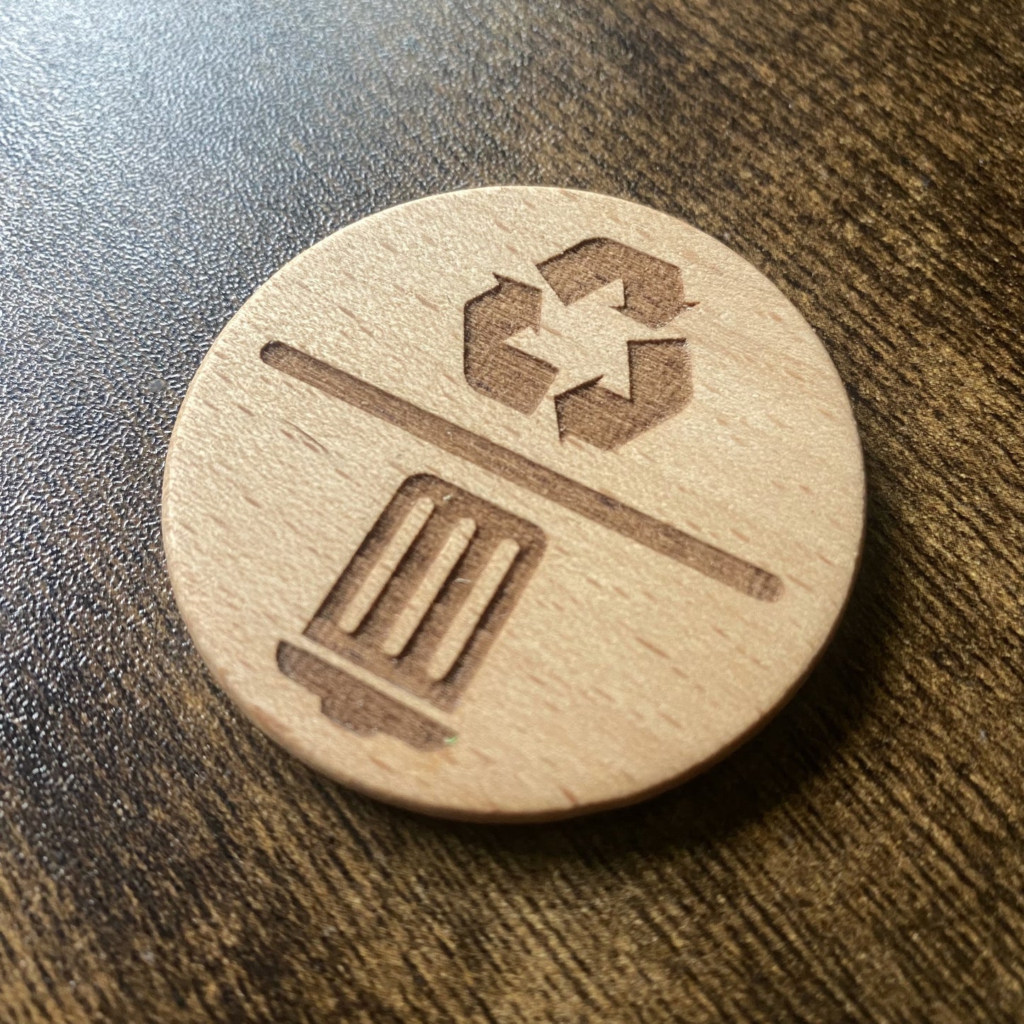 Wooden spinning dial featuring icon designs for bin reminders.