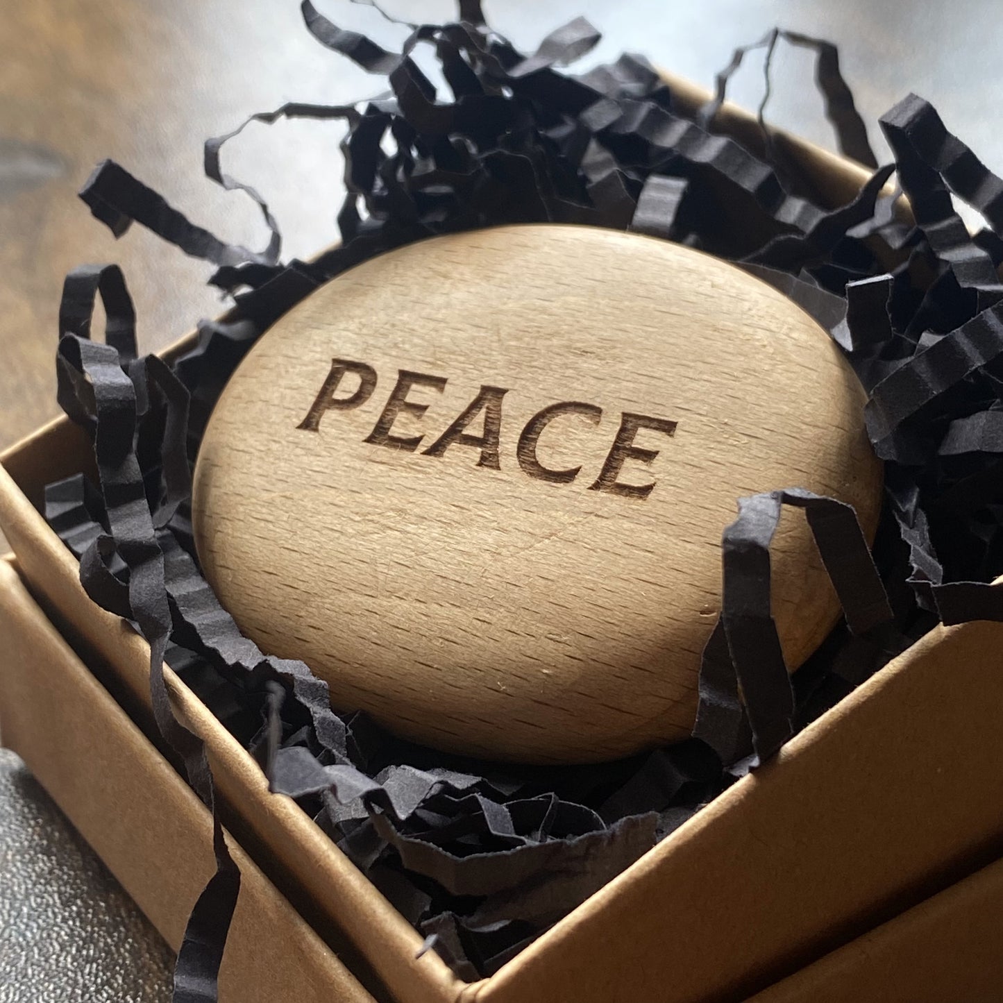 Wooden pocket pebble engraved with ‘Peace’ – calming tactile object in a gift-ready presentation box