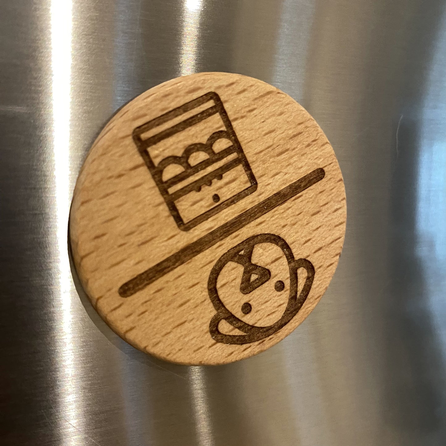 Puppy Power dishwasher spinner magnet displayed on a fridge door.