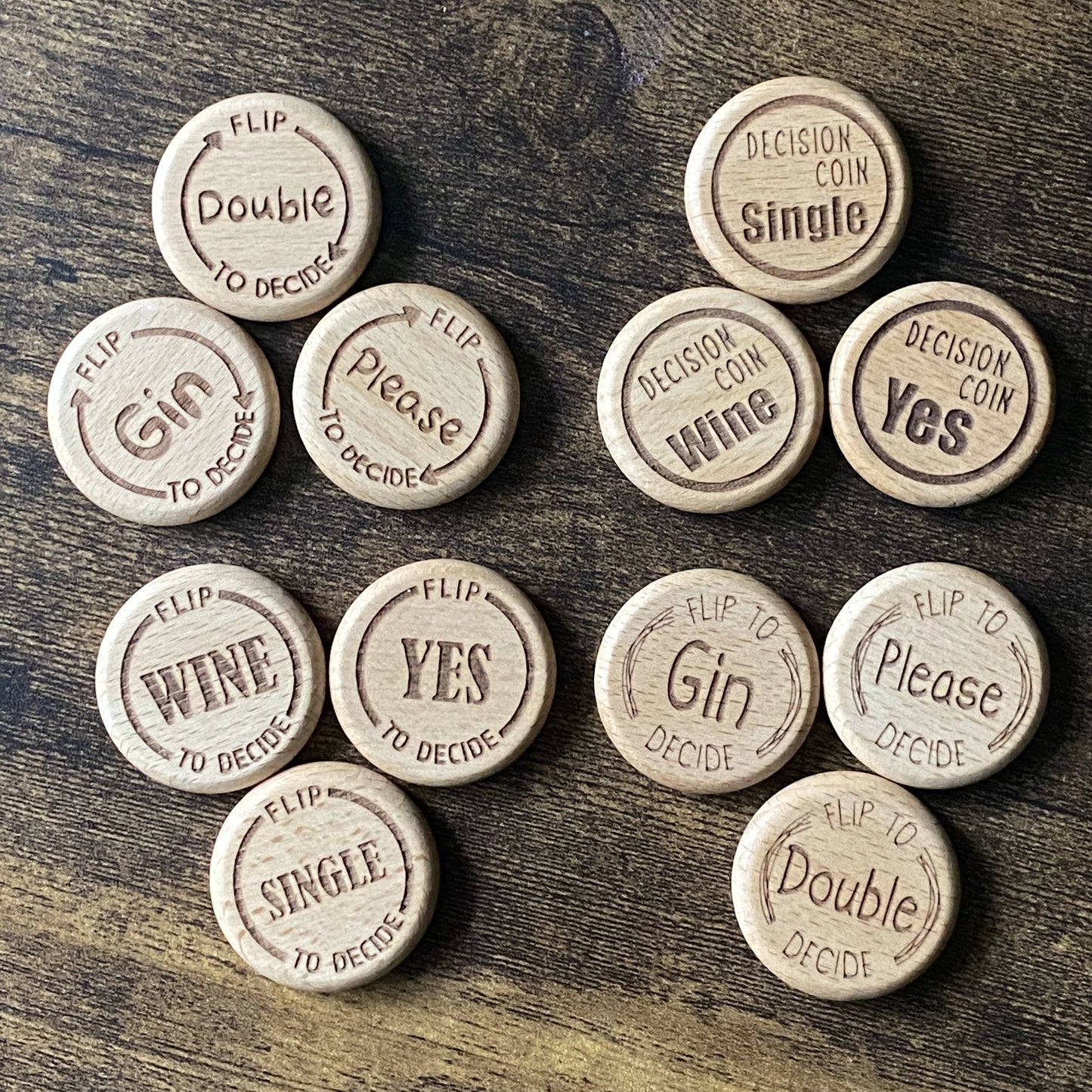 Top-down view of the full Friday Night Drinking Trio Coin Set, featuring all three coins in each of the four unique engraved designs