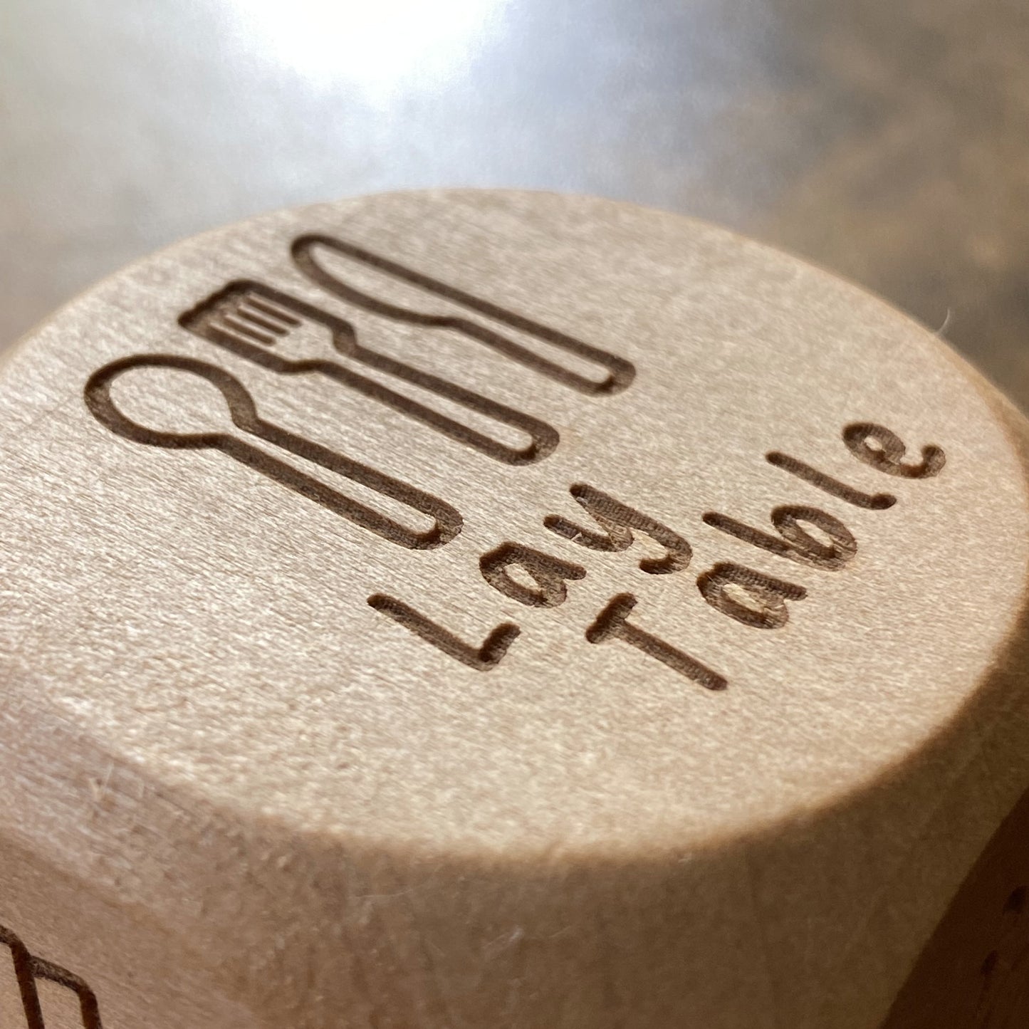 Detailed close-up of Junior Chores Decision Dice showing the “lay table” engraved illustration and text
