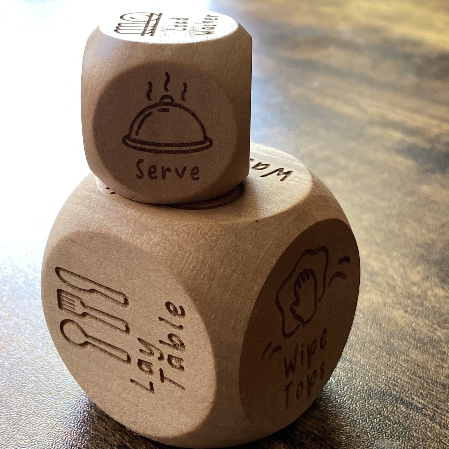 Side-on view of Junior Chores Decision Dice stacked as a tower, showing quality engraved illustrations and smooth wooden finish