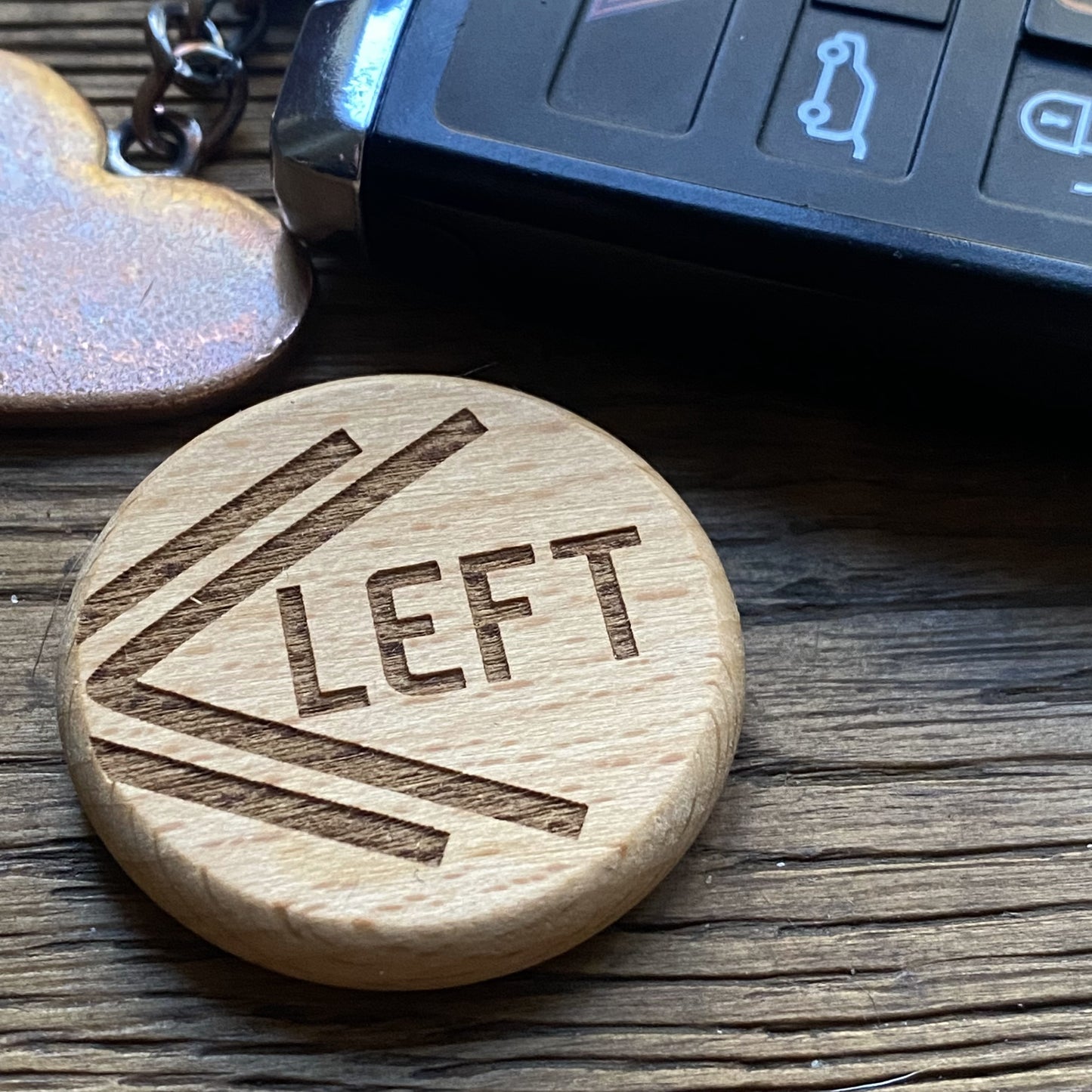 Chevron engraved Penny Hike Coin placed next to car keys, perfect for spontaneous road trips and hikes