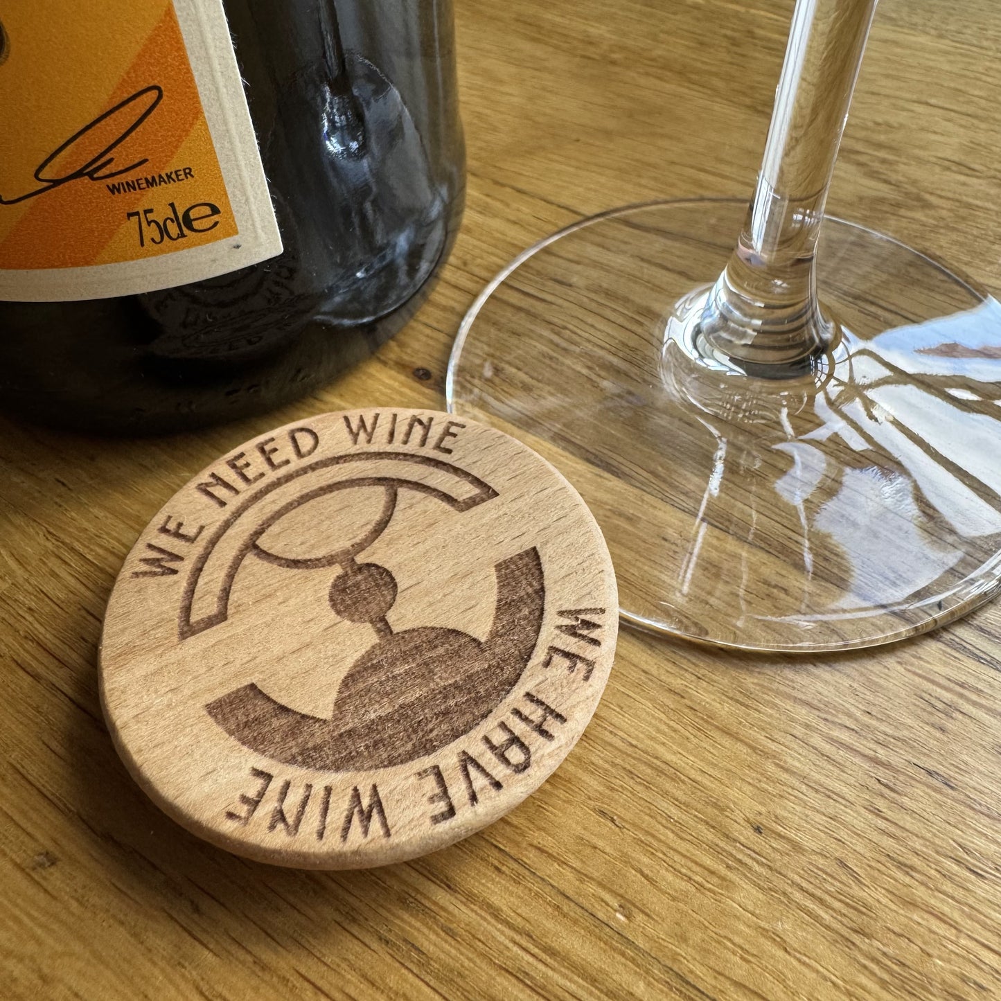 Split Dial Wine Spinner displayed with wine stem and bottle – novelty wine accessory