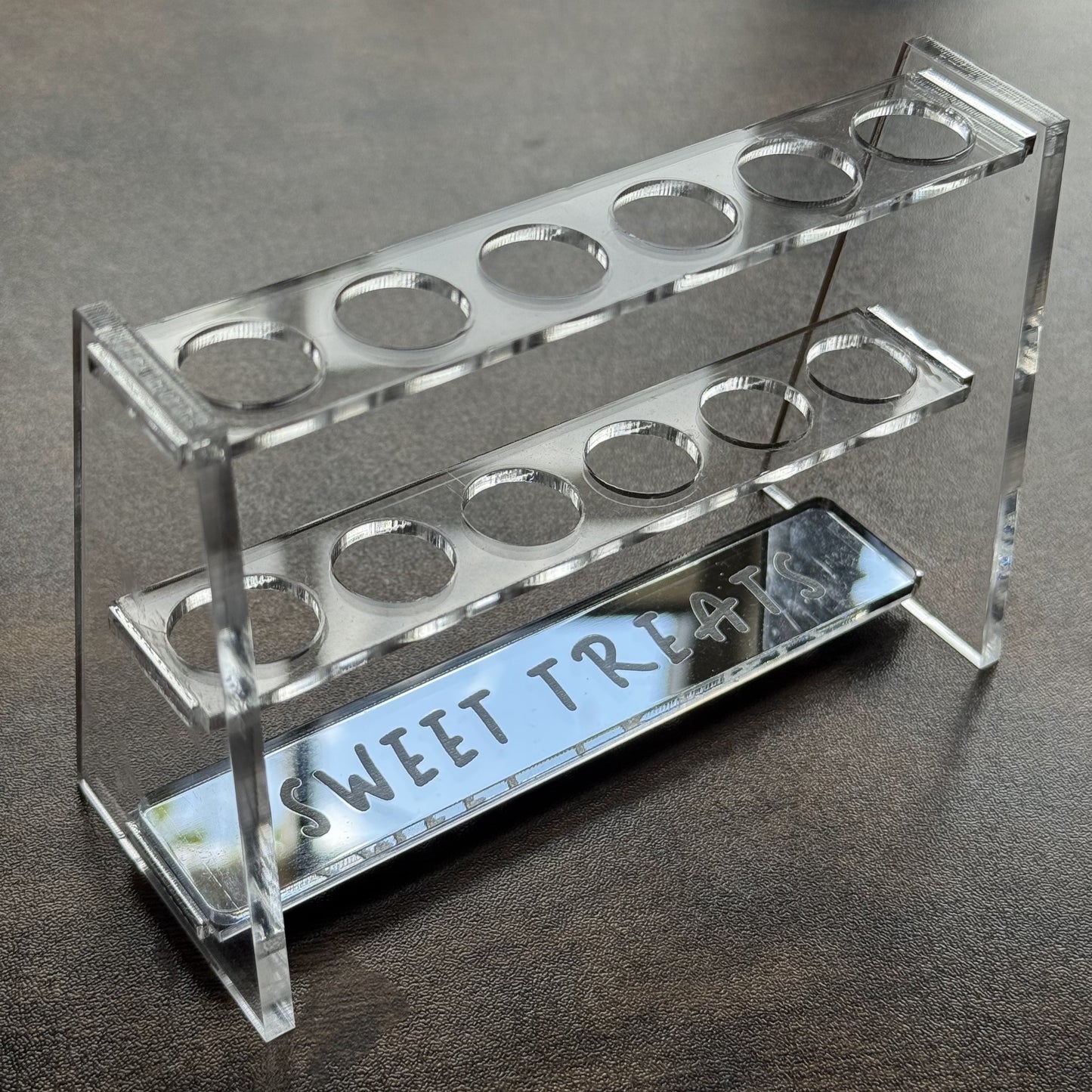 Crystal clear Sweet Sprinkles Test Tube Fun stand with silver mirror “Sweet Treats” engraving on a dark background