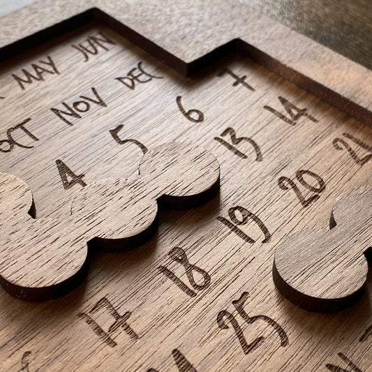 Close-up of Daily Perpetual Calendar Puzzle pieces, highlighting stunning engraving details and intricate craftsmanship.