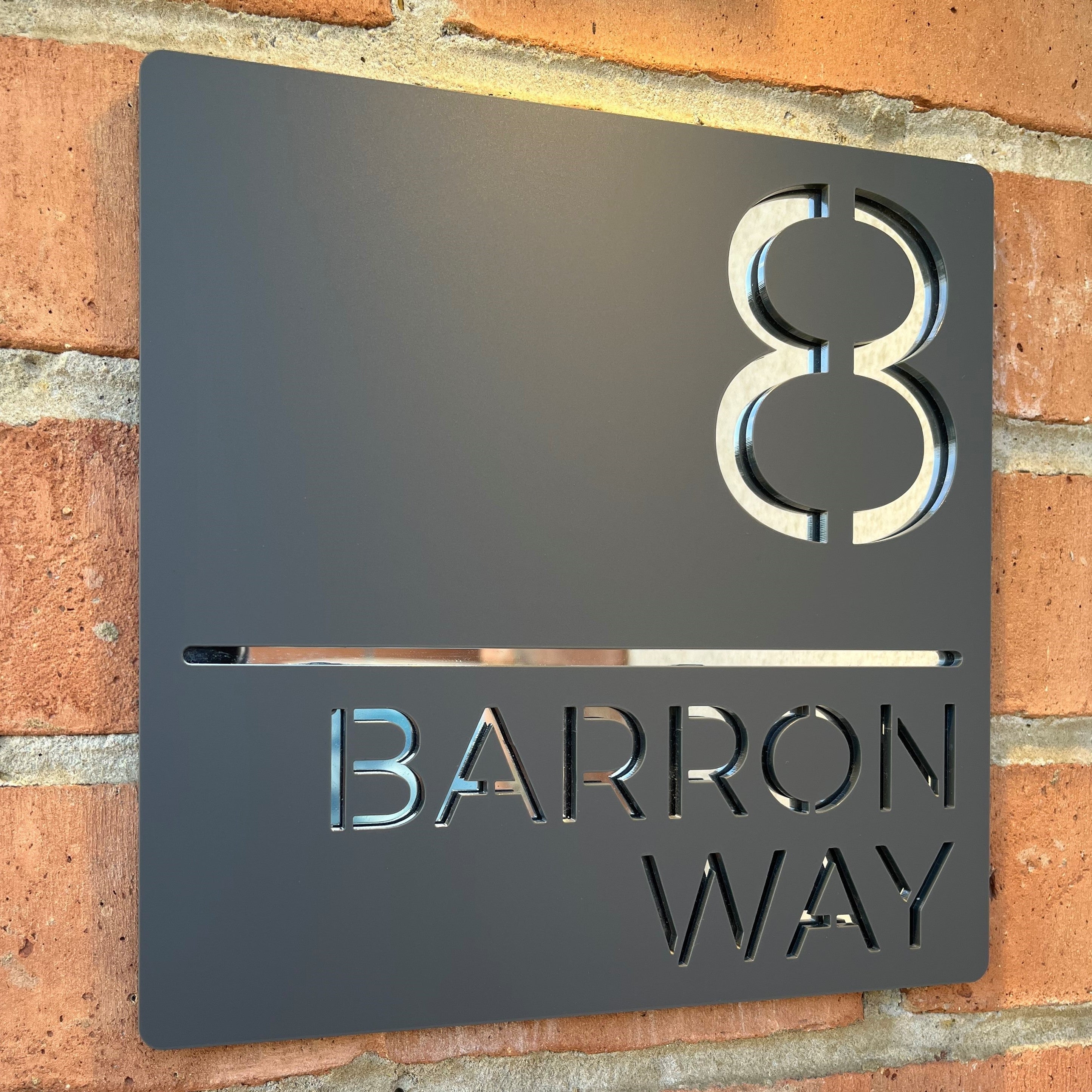 House sign featuring mirrored layered acrylic elements for a sleek and contemporary look