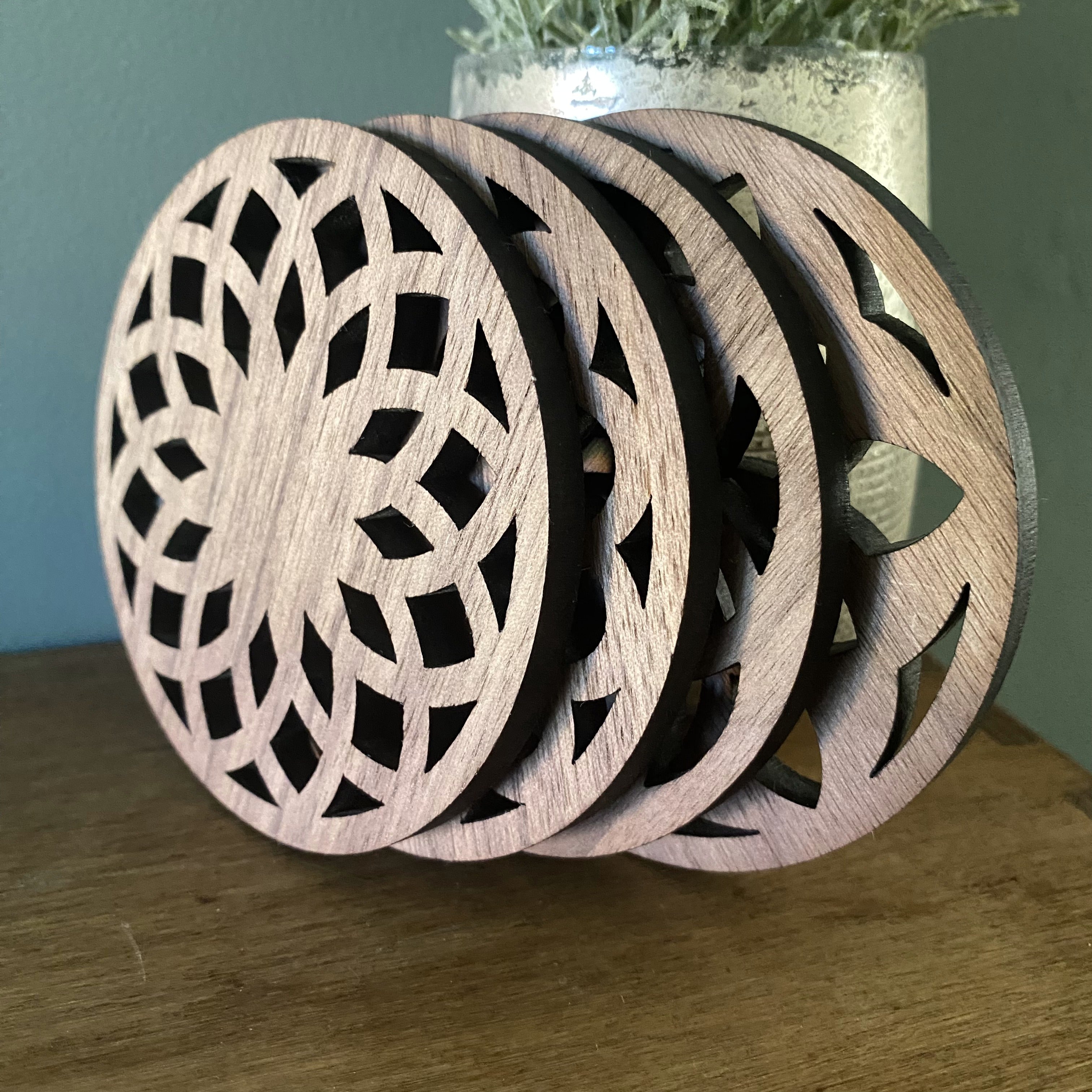 Contemporary coasters with abstract floral designs in cut out wood design