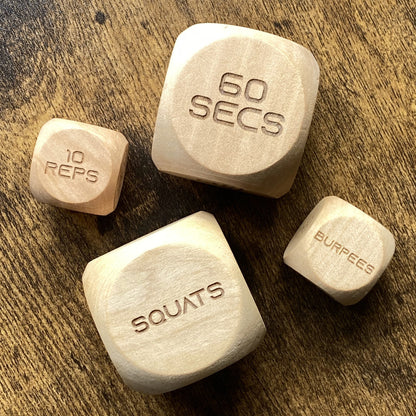 Top-down image showing two sizes of Adult Exercise Decision Dice side-by-side for workout flexibility