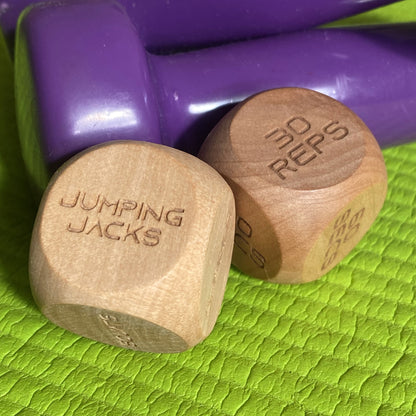 Adult Exercise Decision Dice displayed with home exercise equipment, highlighting workout variety