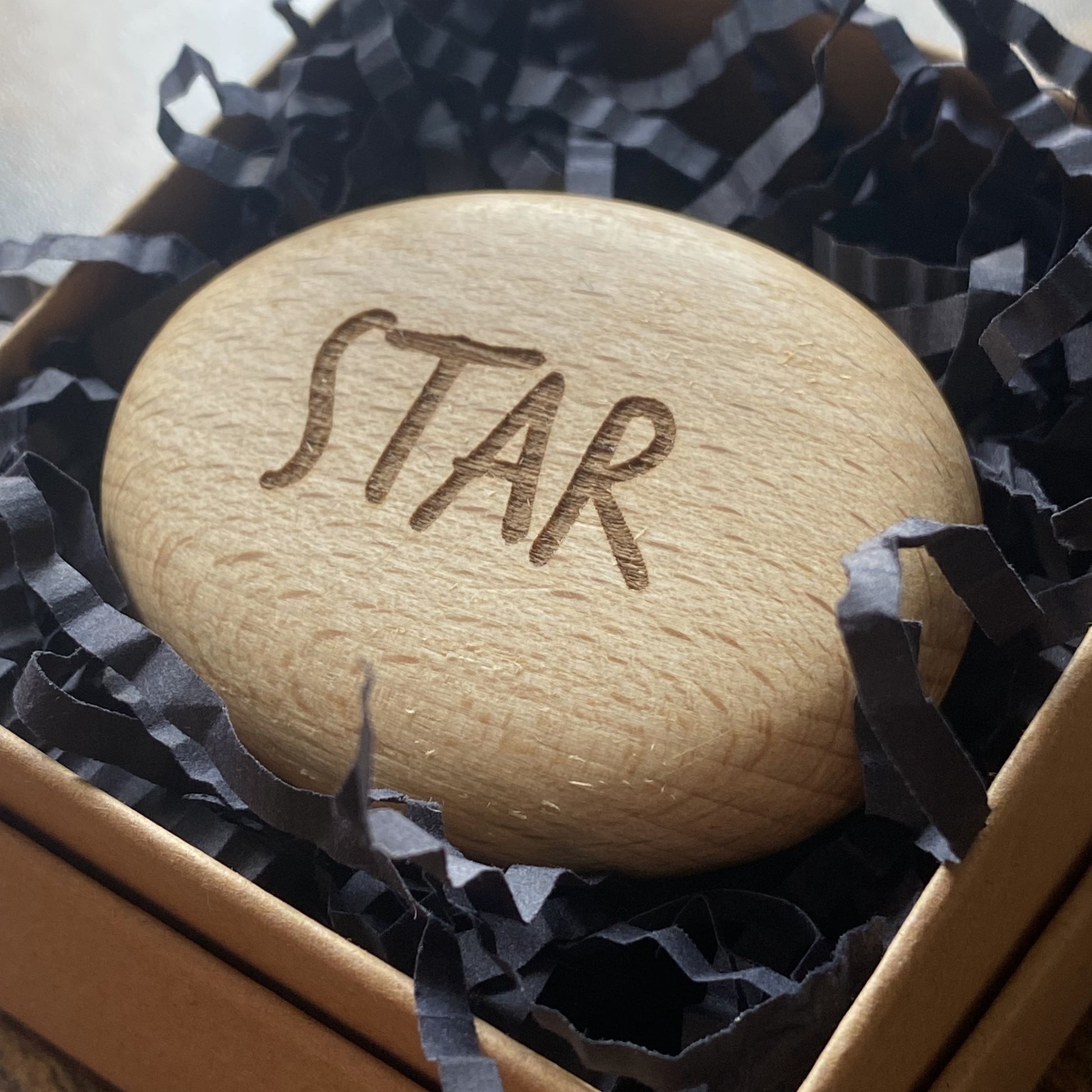 Affirmation wooden pocket pebble engraved with 'Star' – shown in presentation box as a meaningful, calming gift