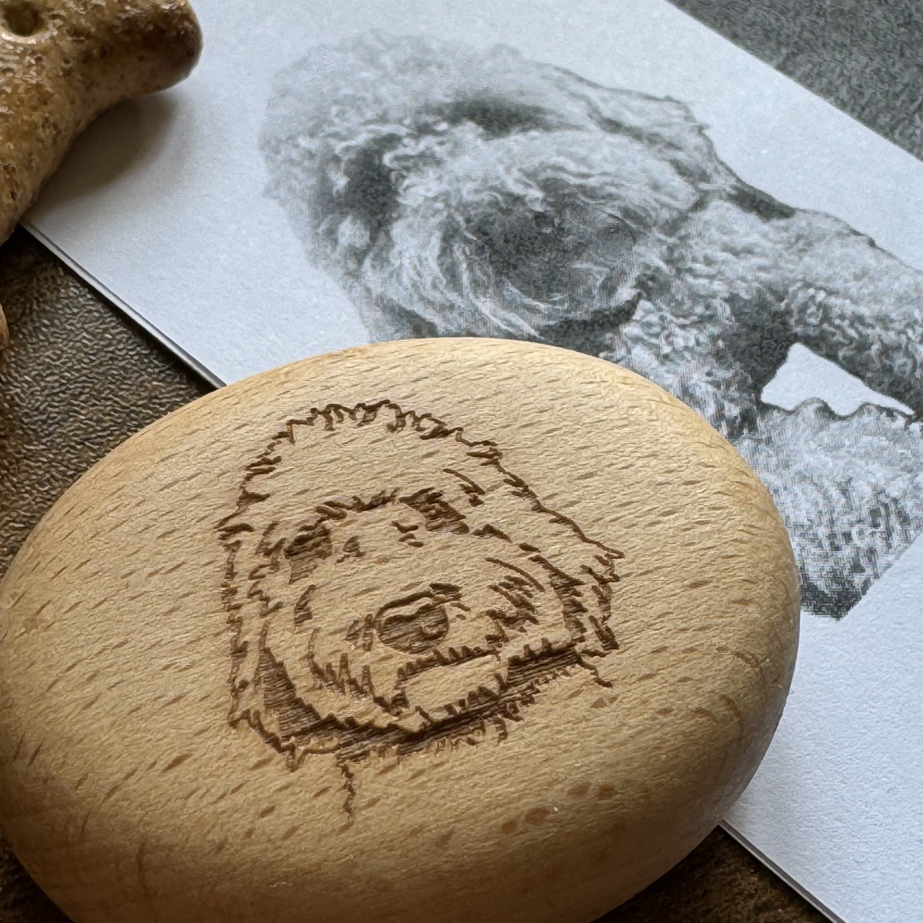 Custom pet portrait engraved on smooth wooden pebble – tactile personalised keepsake with photo etching