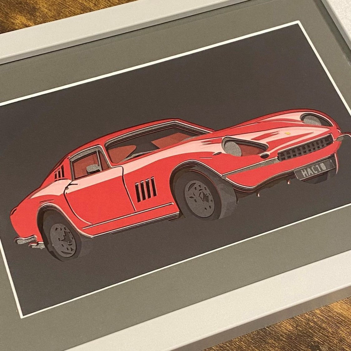 Framed personalised layered papercut artwork featuring vintage Ferrari car – bespoke wall art with intricate detailing