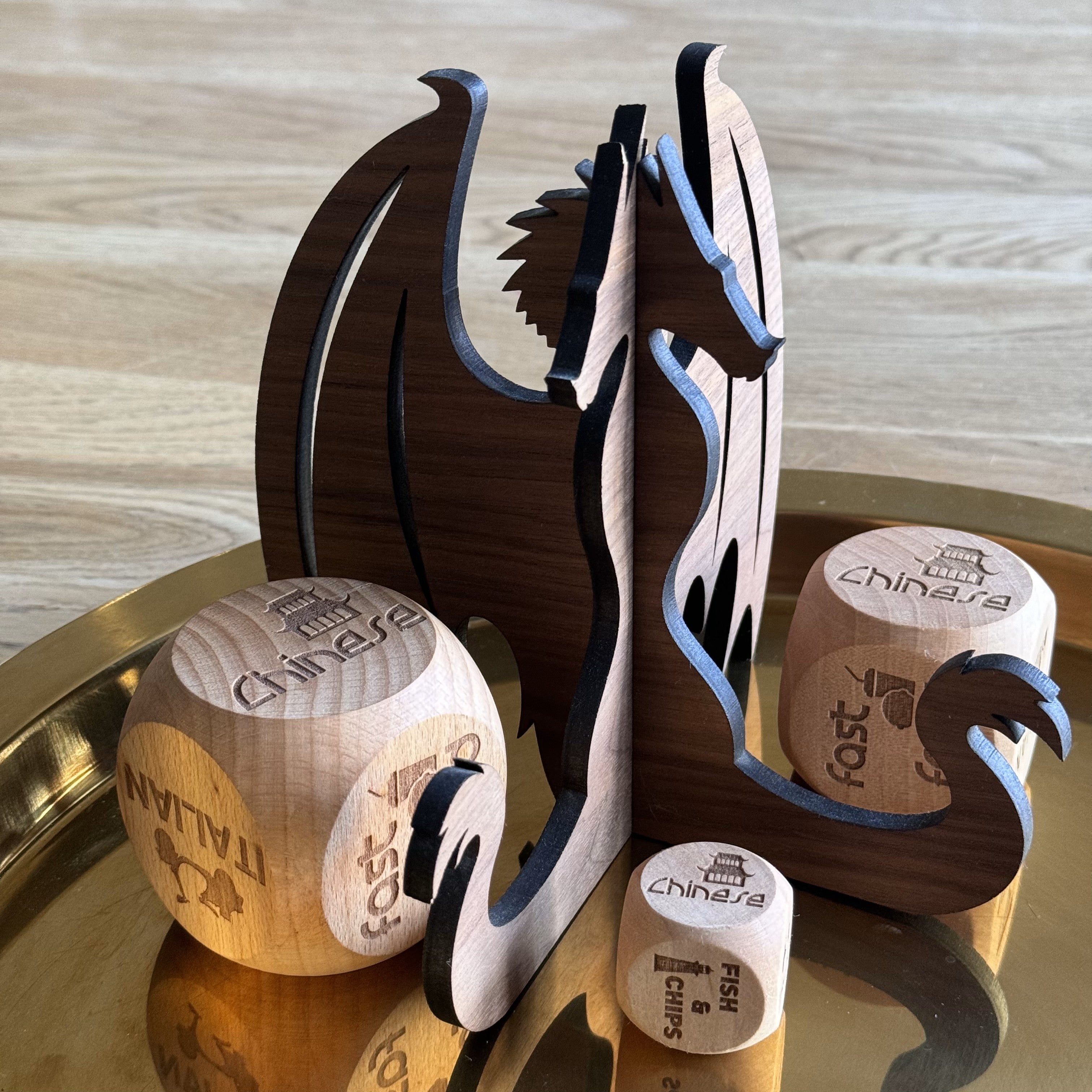 Studio-designed walnut dragon stand for books or tablets, styled on gold tray with Chinese takeout dice