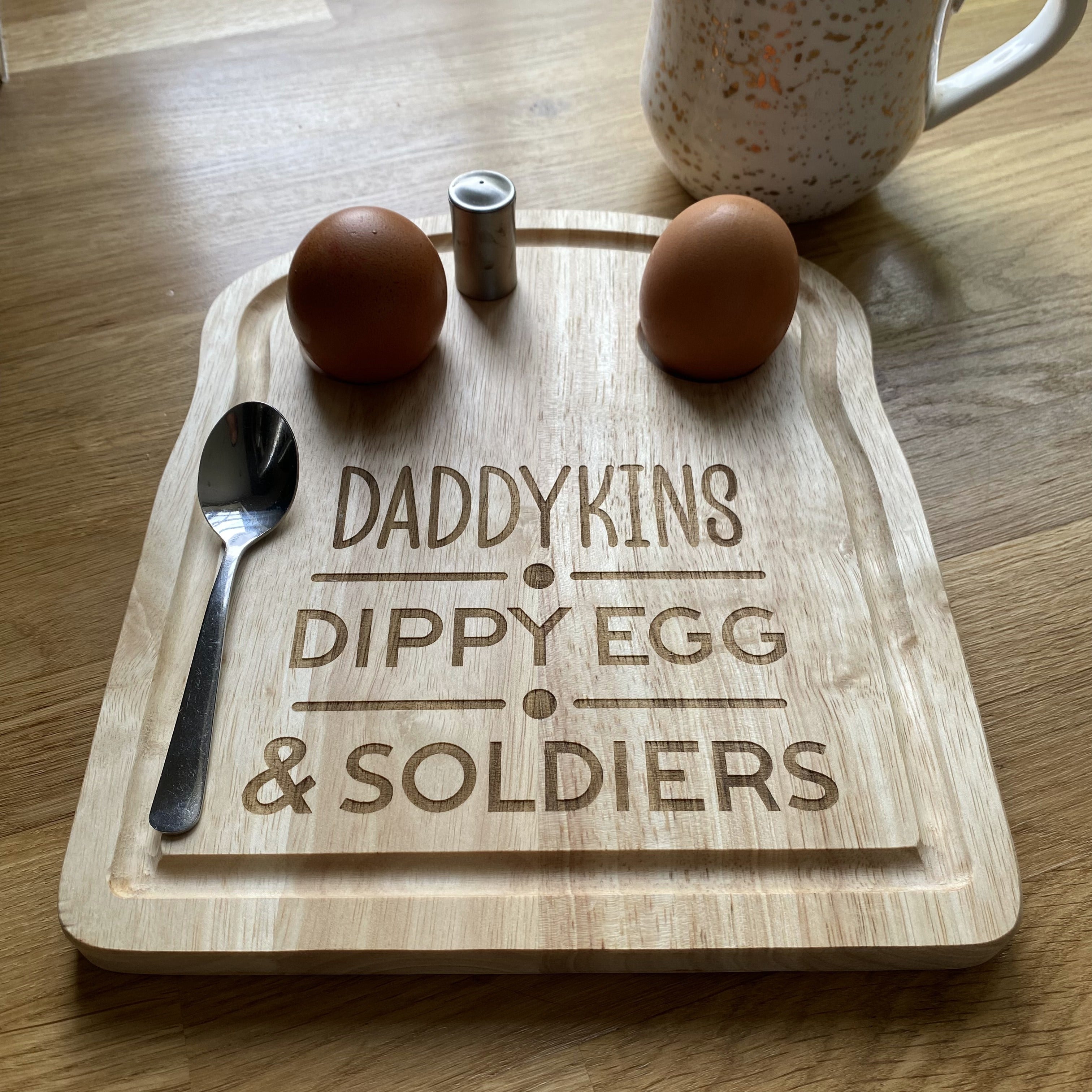 Bespoke engraved breakfast board with boiled eggs displayed in a breakfast setting