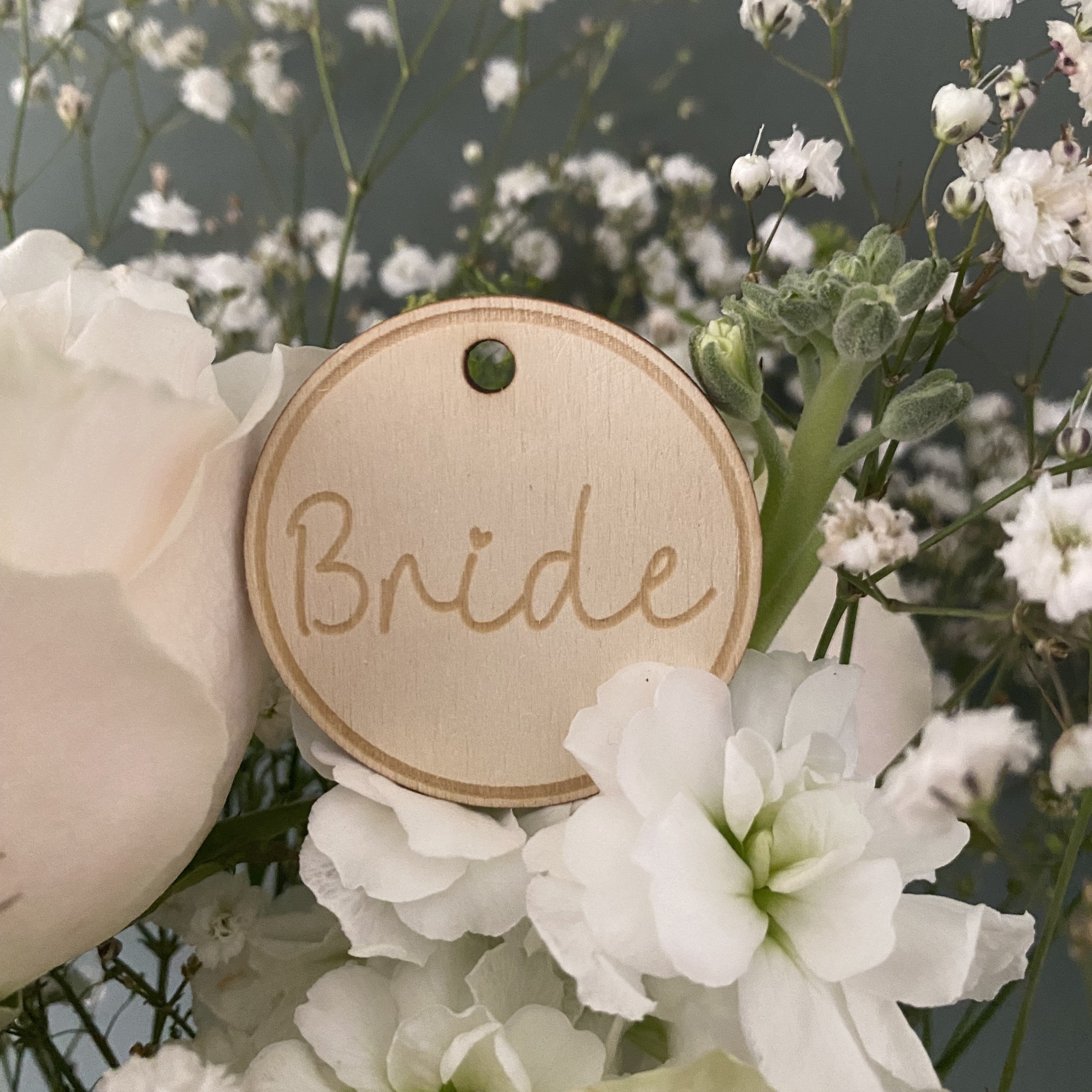Custom wooden bride flower identification tags for weddings, engraved with elegant floral designs