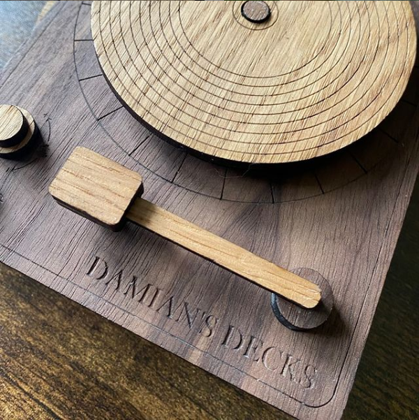Detailed close-up of a vinyl record decks coaster set featuring detail engraved records and personalisation