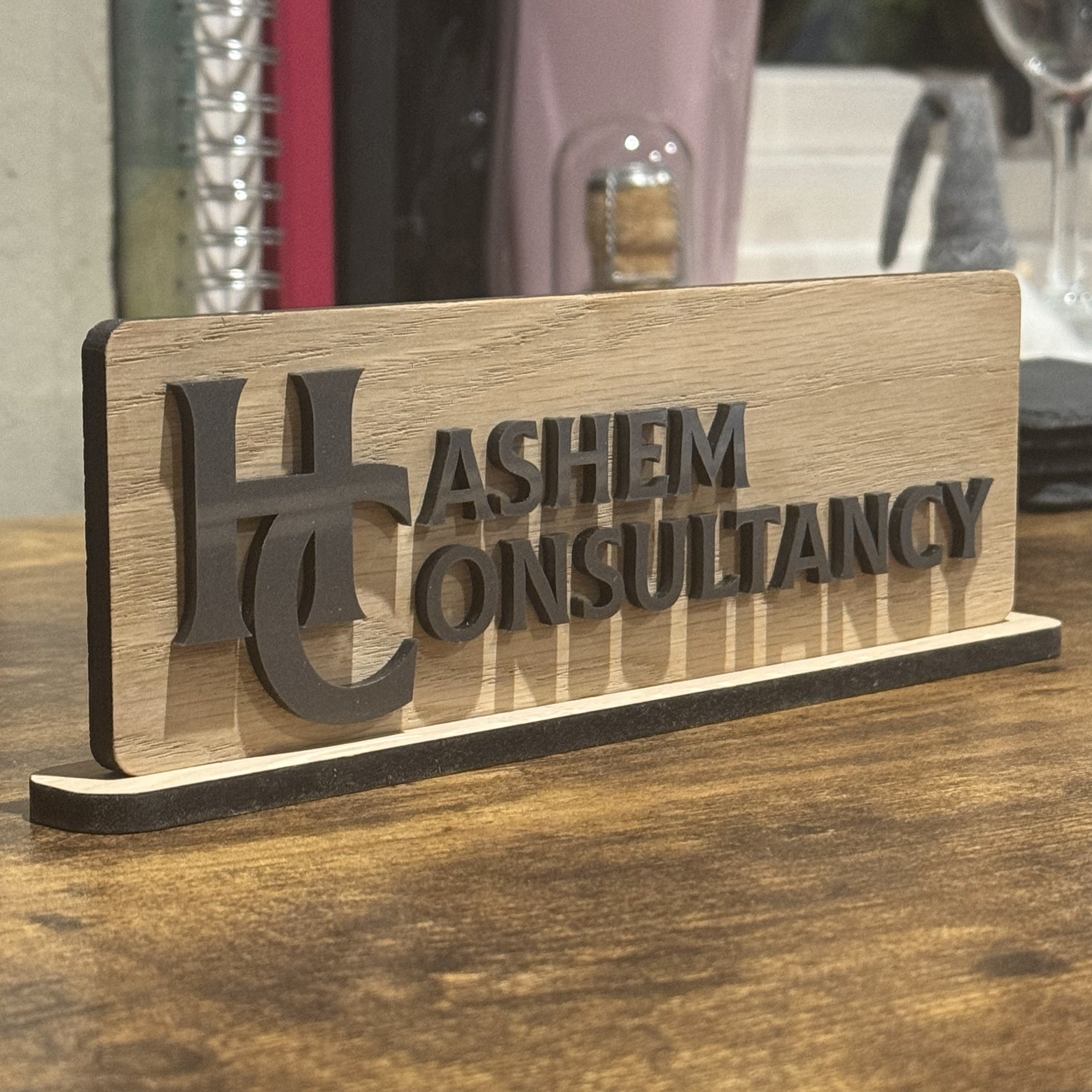 Portable wooden desk sign branded for company use, perfect for meetings and events