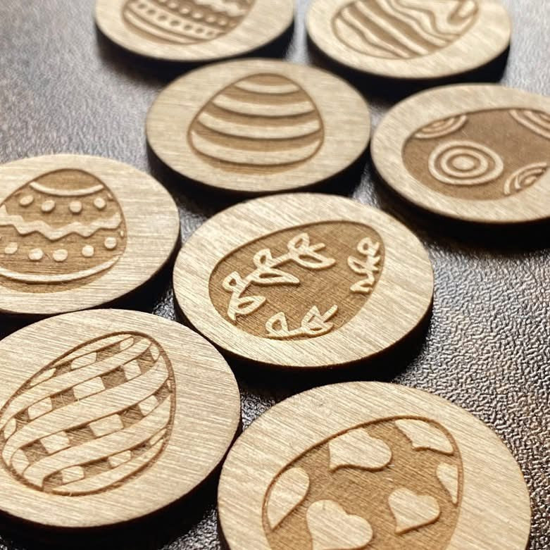 Set of Easter-themed engraved wooden tokens featuring seasonal designs