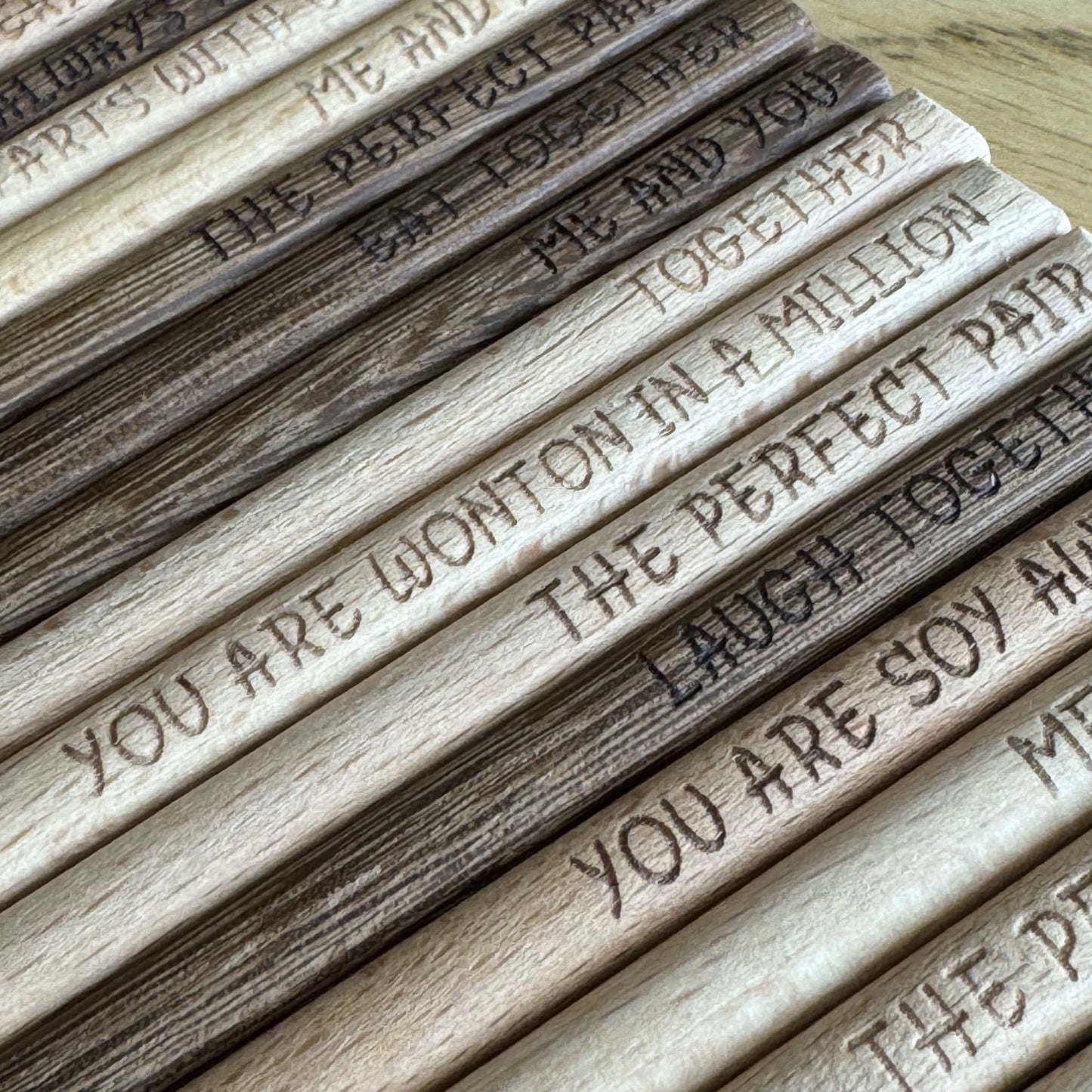 Close-up of engraved chopsticks lined up to show detail and finish.