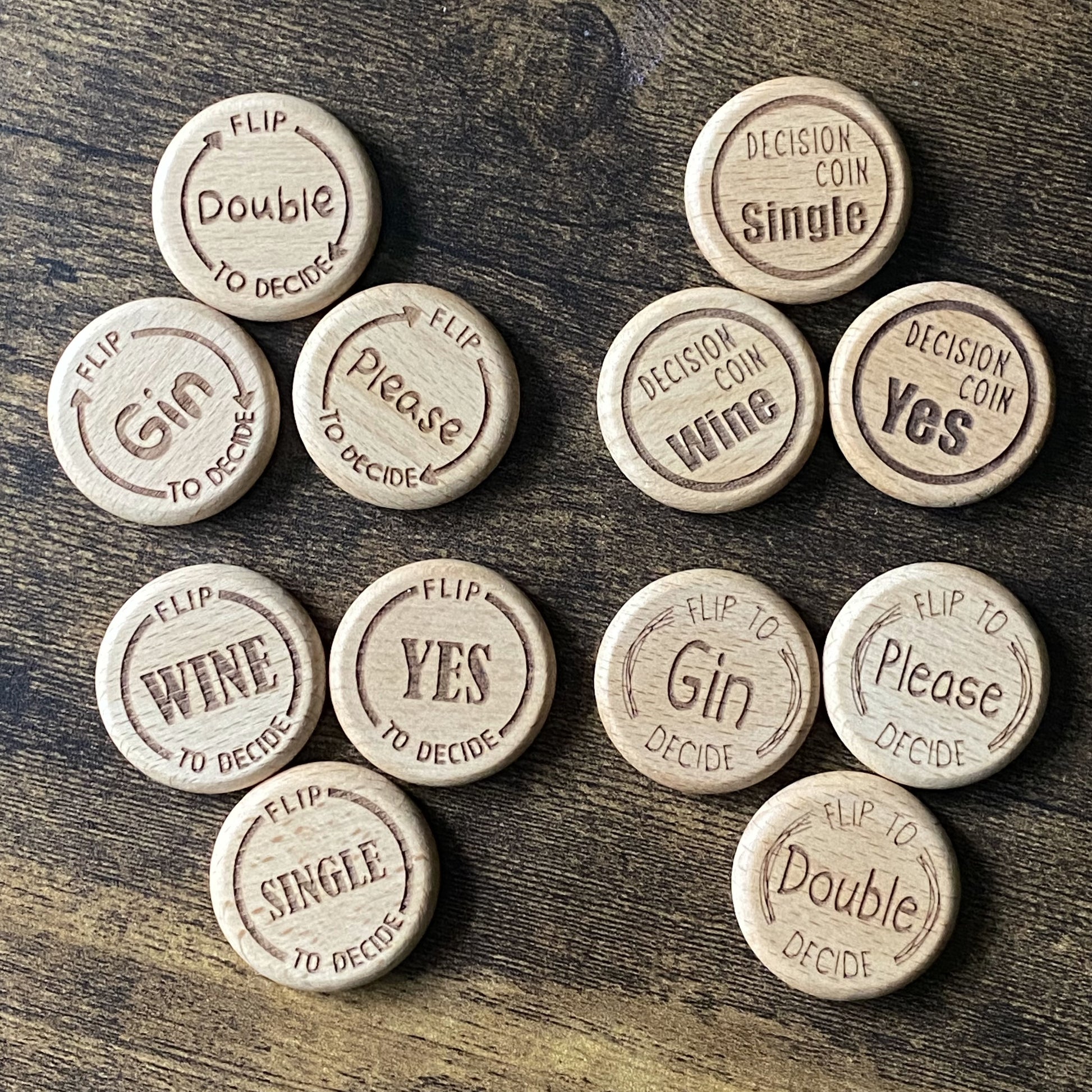 Top-down view of the full Friday Night Drinking Trio Coin Set, featuring all three coins in each of the four unique engraved designs