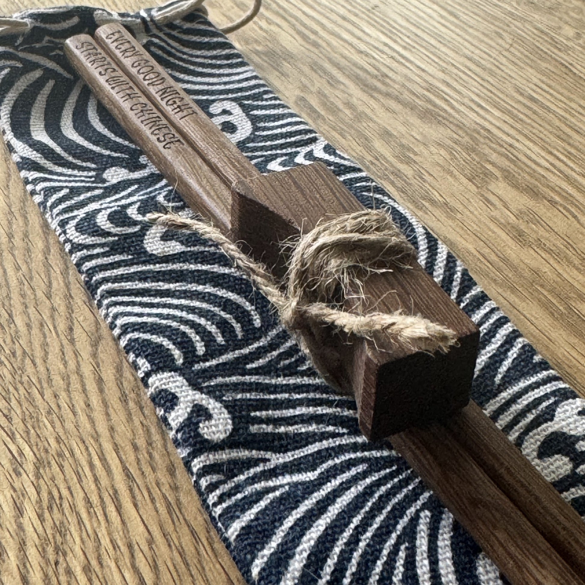 Complete engraved chopstick set presented gift-ready with pouch and rest.