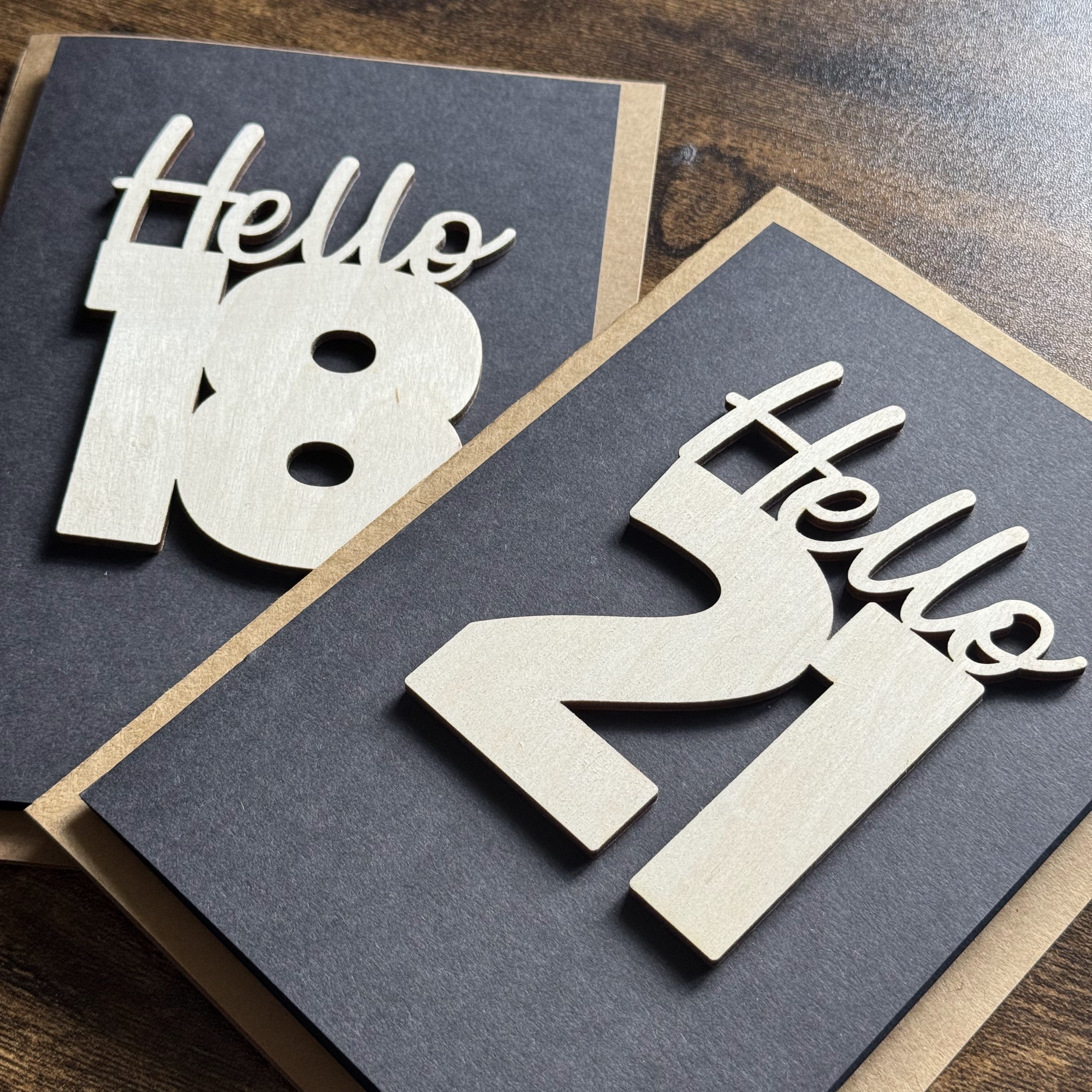 Wooden charm greeting cards showing both “Hello 21” and “Hello 18” designs for lasting bespoke gifting
