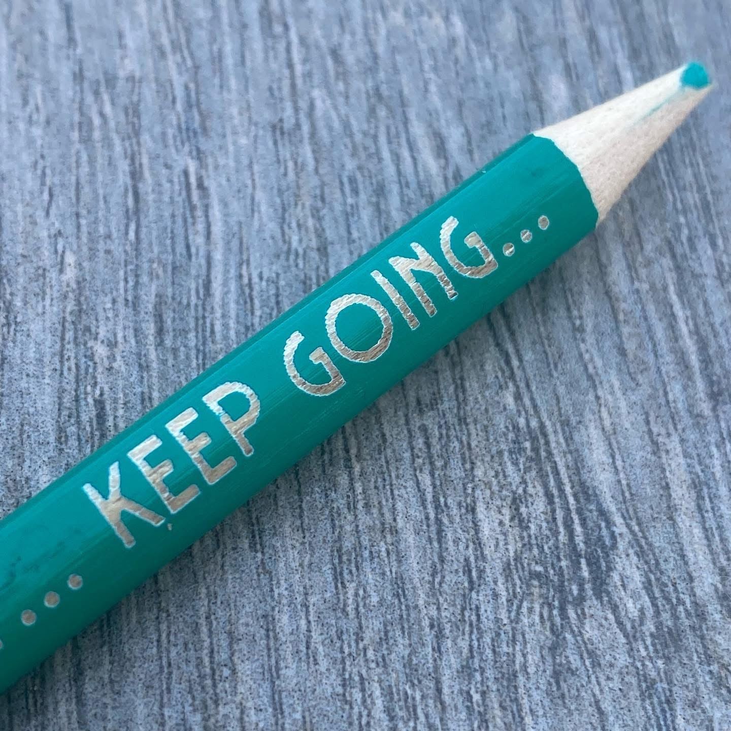 Wooden pencil engraved with the motivational message ‘Keep going’, perfect for gifting or stationery lovers