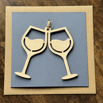 Wooden Keepsake Charm Card featuring Wine Glasses design – a celebratory charm card for special occasion gifting, with lasting hanging memento  