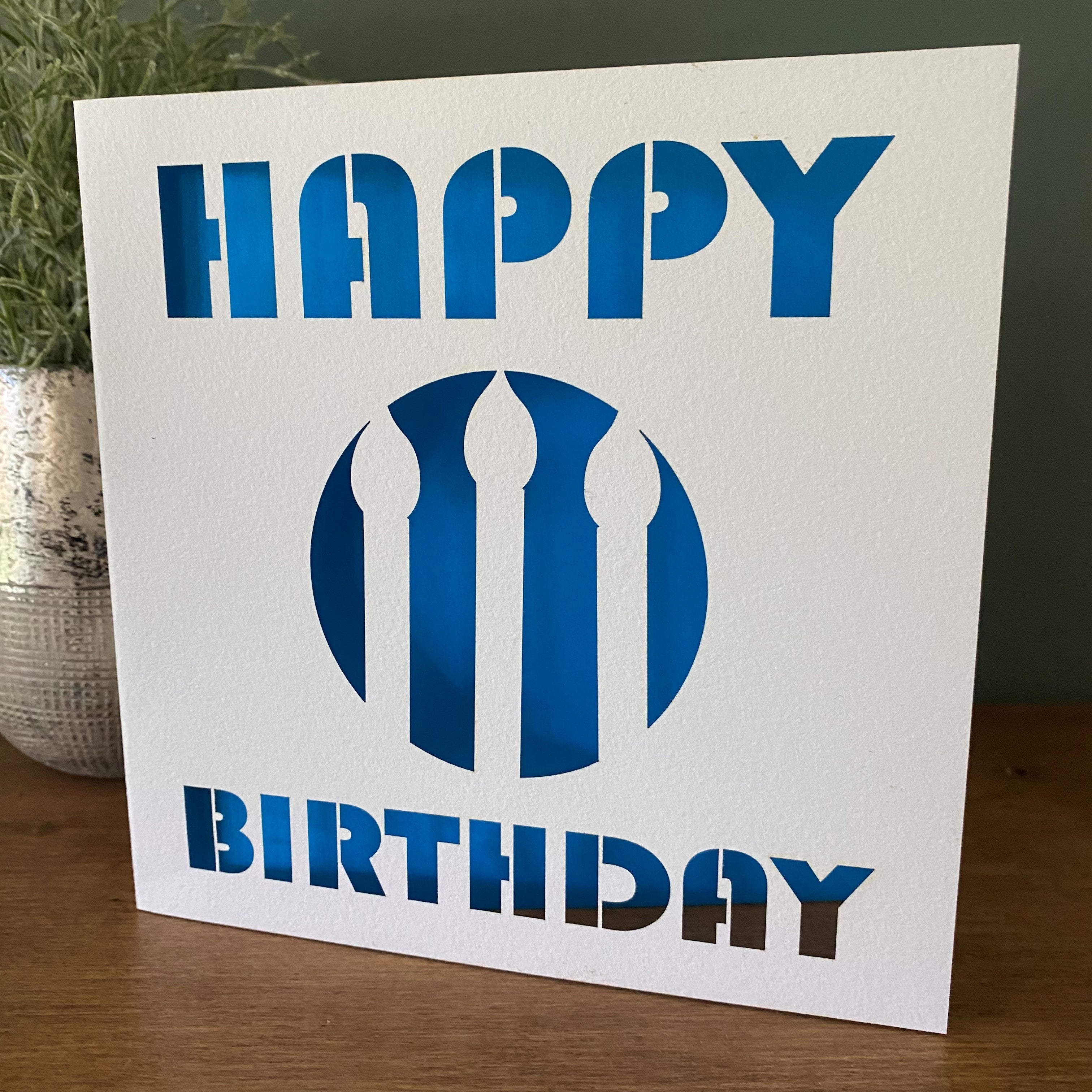 Birthday card featuring laser-cut candle design with coloured card