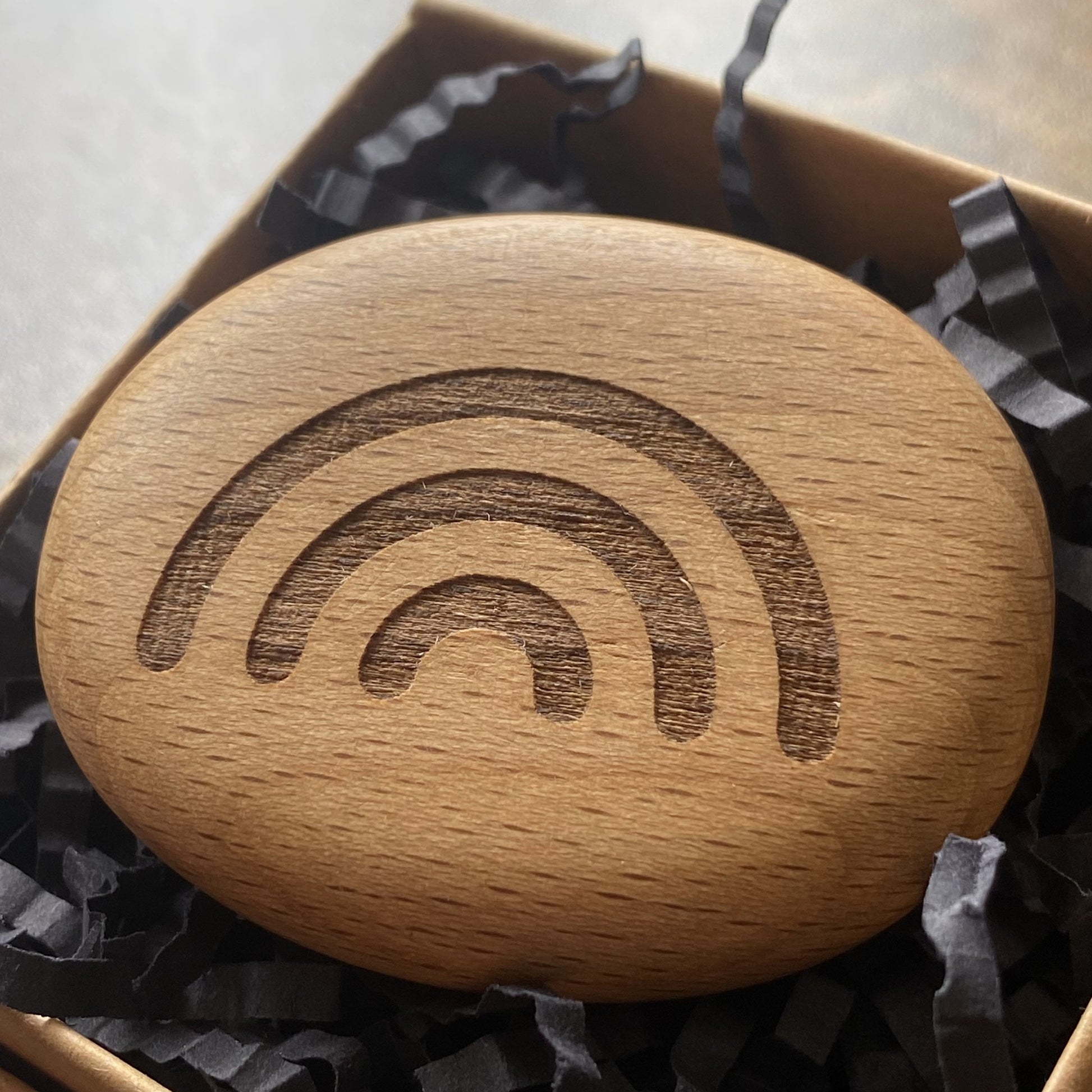 Rainbow symbol pocket pebble – engraved wooden charm for good luck, presented in a gift box