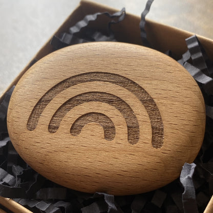 Rainbow symbol pocket pebble – engraved wooden charm for good luck, presented in a gift box
