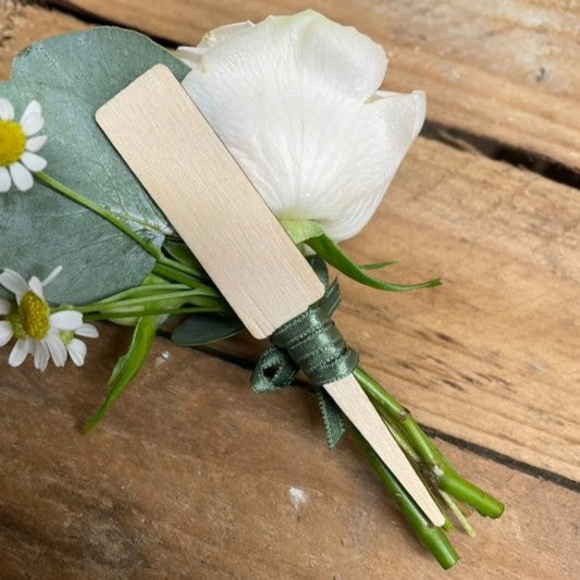 Magnetic buttonhole base and floral holder, designed for easy wear and elegant presentation at weddings or formal events