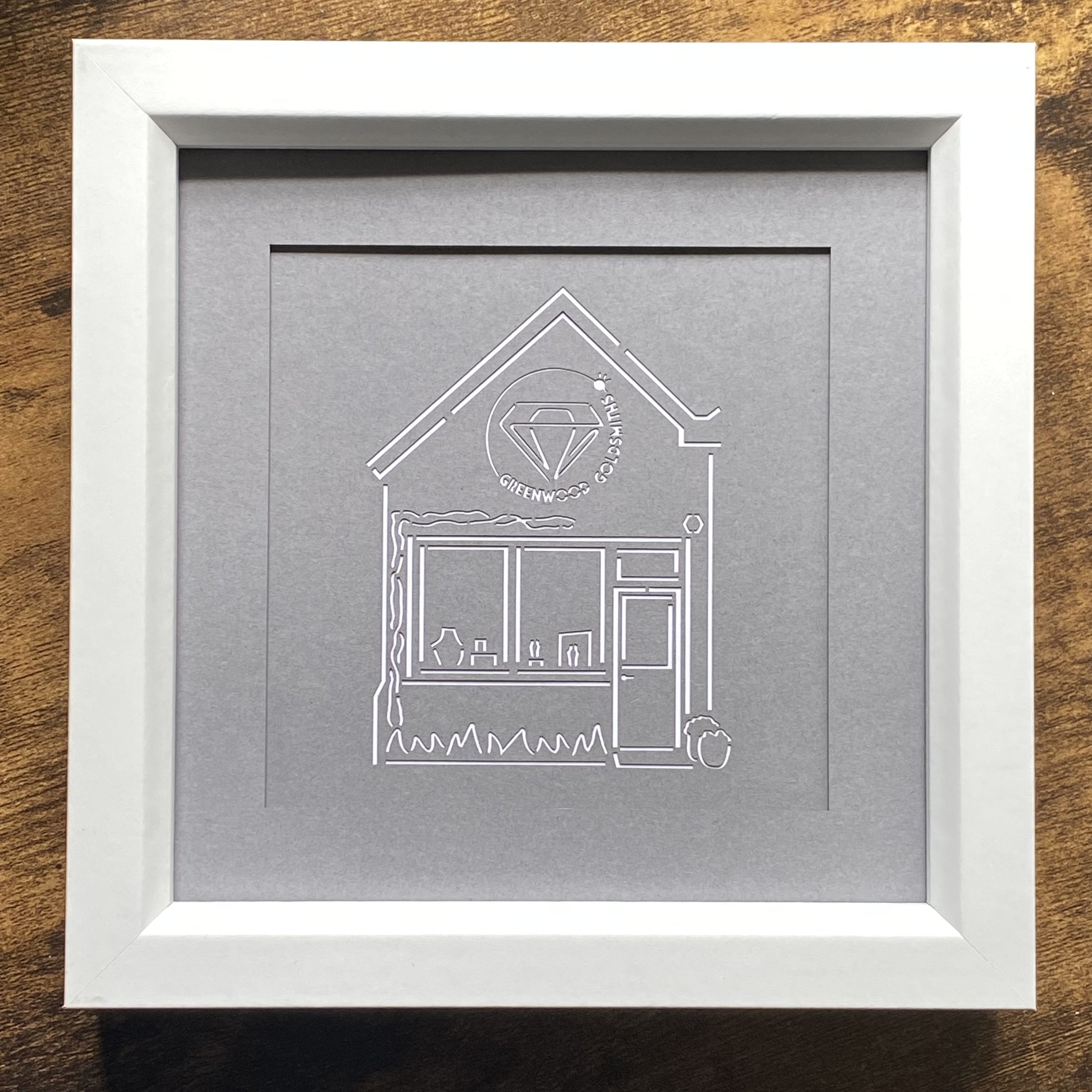Top-down view of an intricate laser-cut papercut design by In the Oaks of business premise