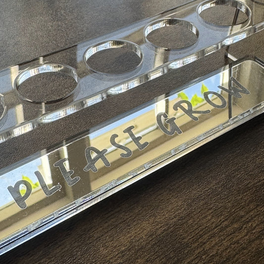 Close-up of mirror engraving “Please Grow” on Propagation Station – plant accessory