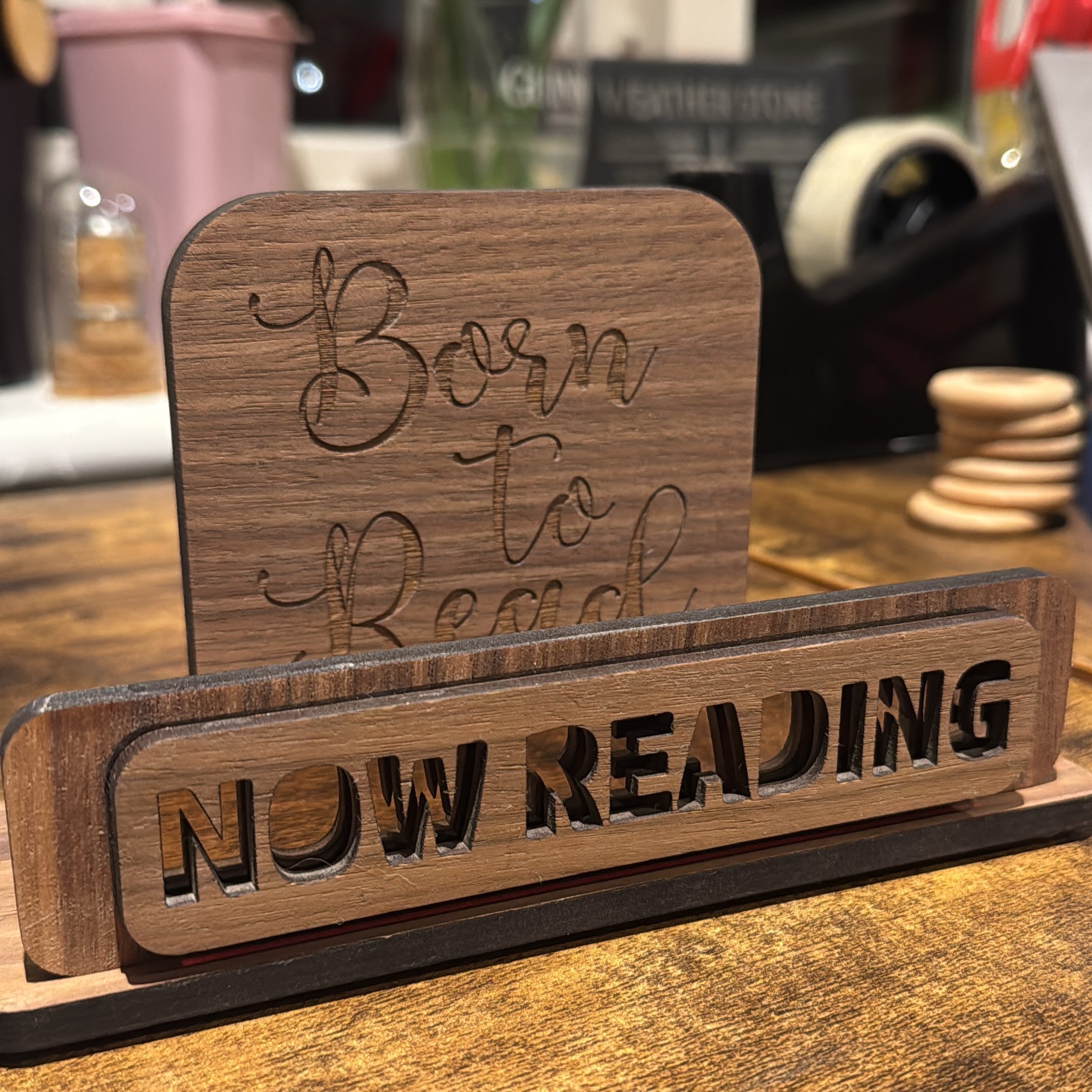 Elegant now reading book stand featuring contemporary mirror detailing, perfect for stylish home décor
