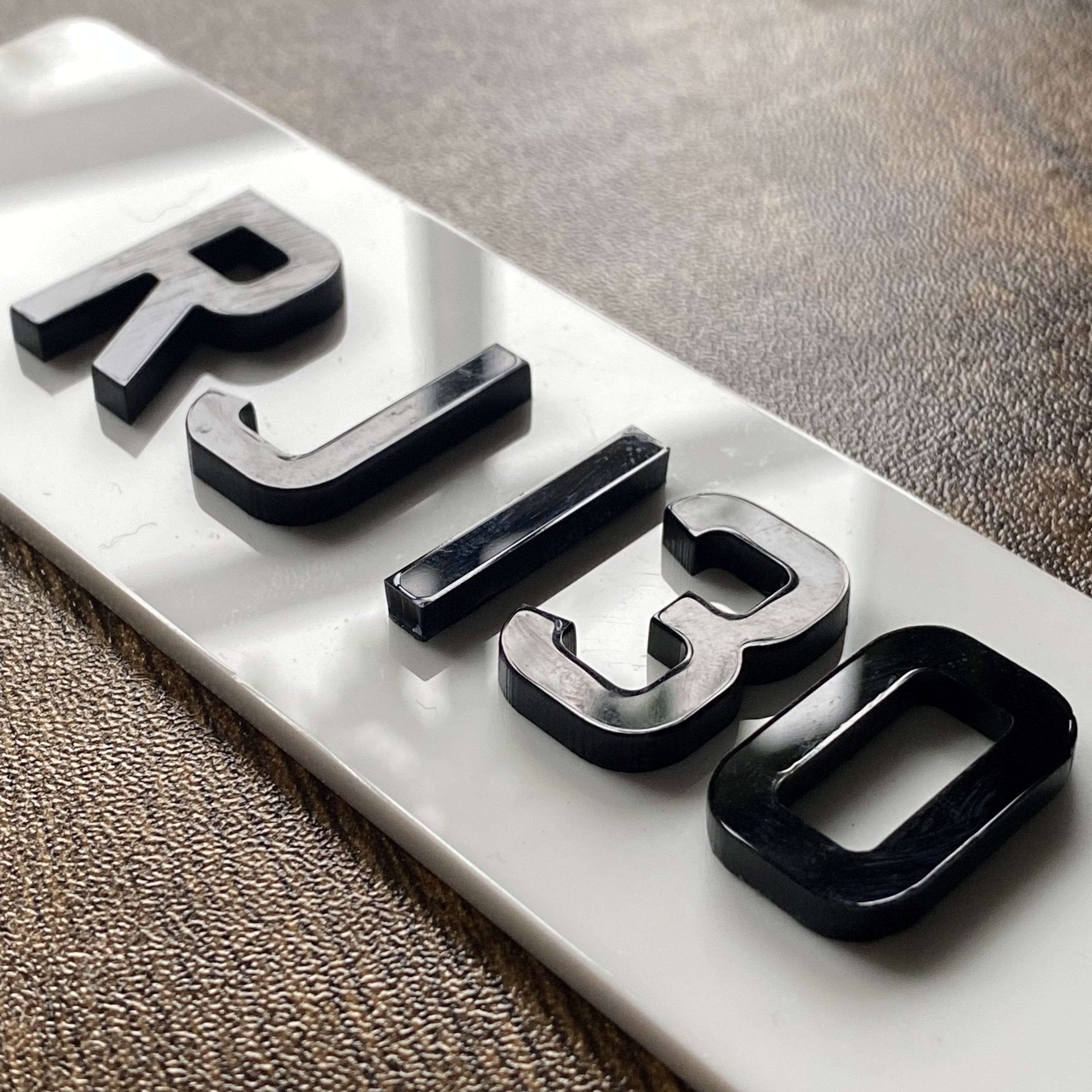 Small bespoke engraved wooden numberplate for display purposes