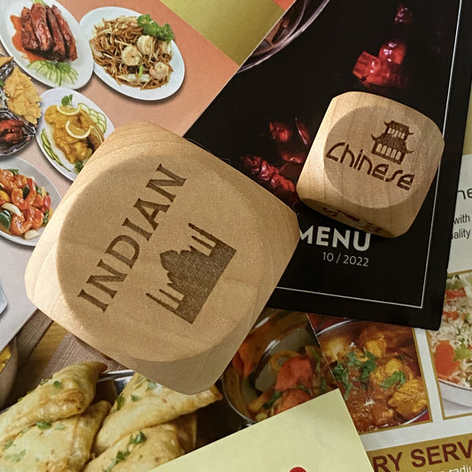 Top-down view of pocket and jumbo sizes of Takeout Decision Dice on Indian and Chinese restaurant menus