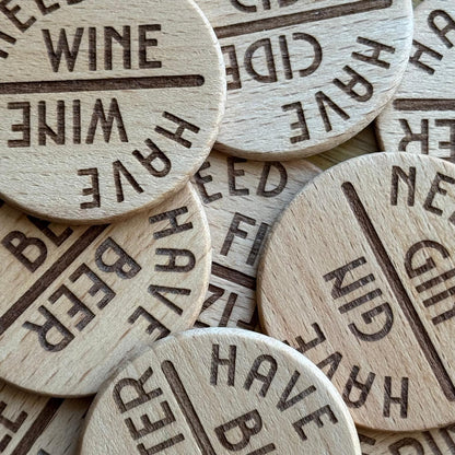 Top-down view of scattered pile of tipple drink status spinning dials - novelty bar accessory