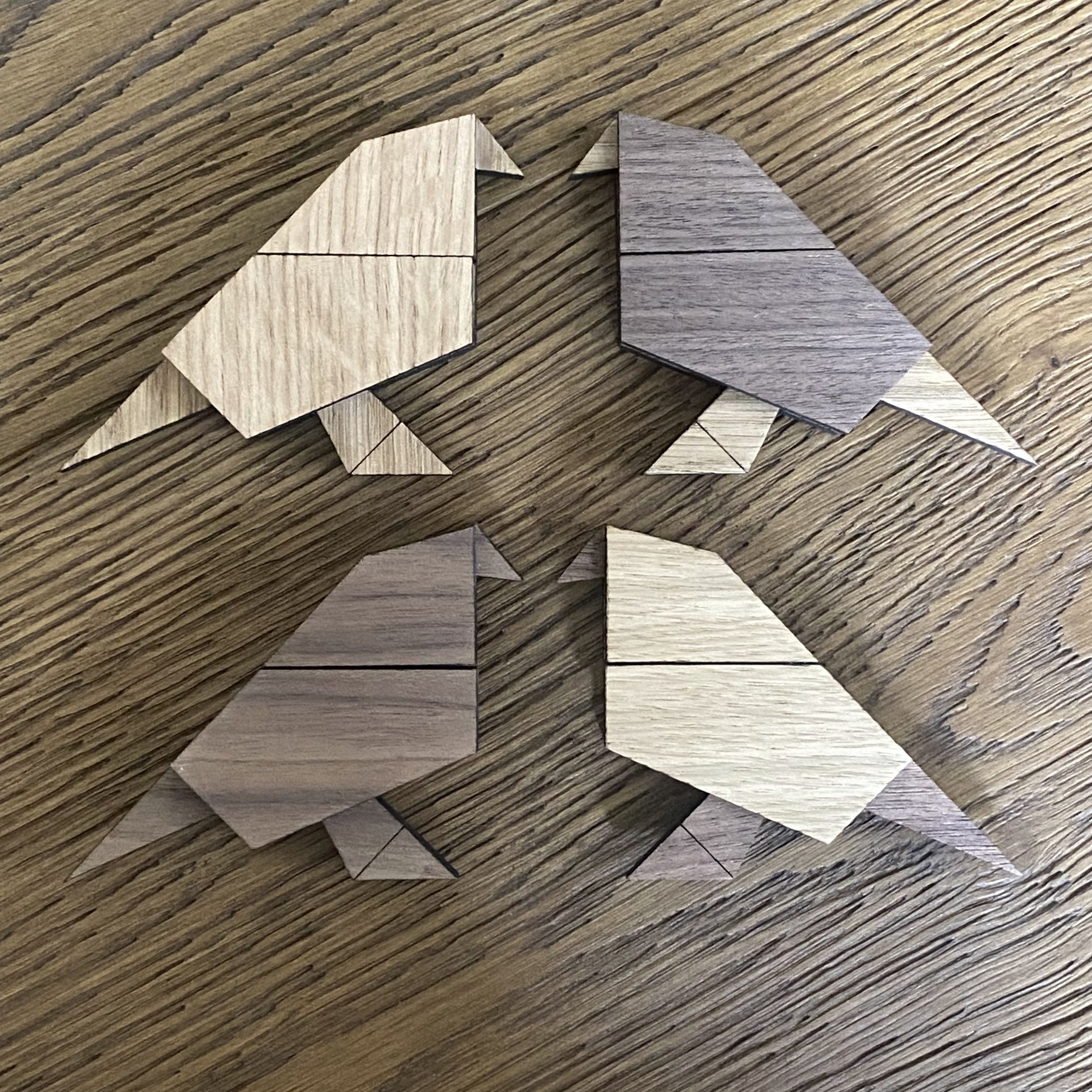Small wooden bird ornament inspired by origami folds, combining minimalist design with natural materials