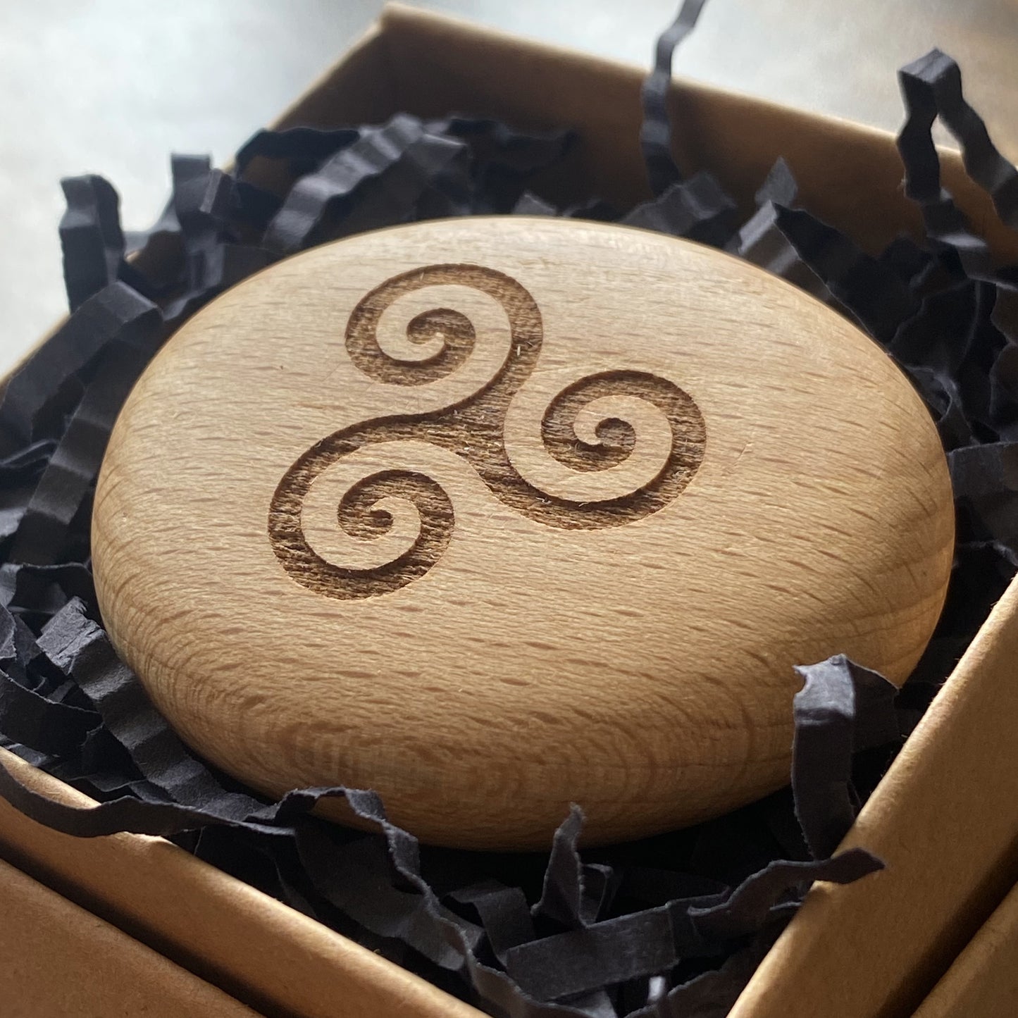 Triskelion spiral design engraved on wooden pocket pebble – Celtic symbol of love and unity in gift box